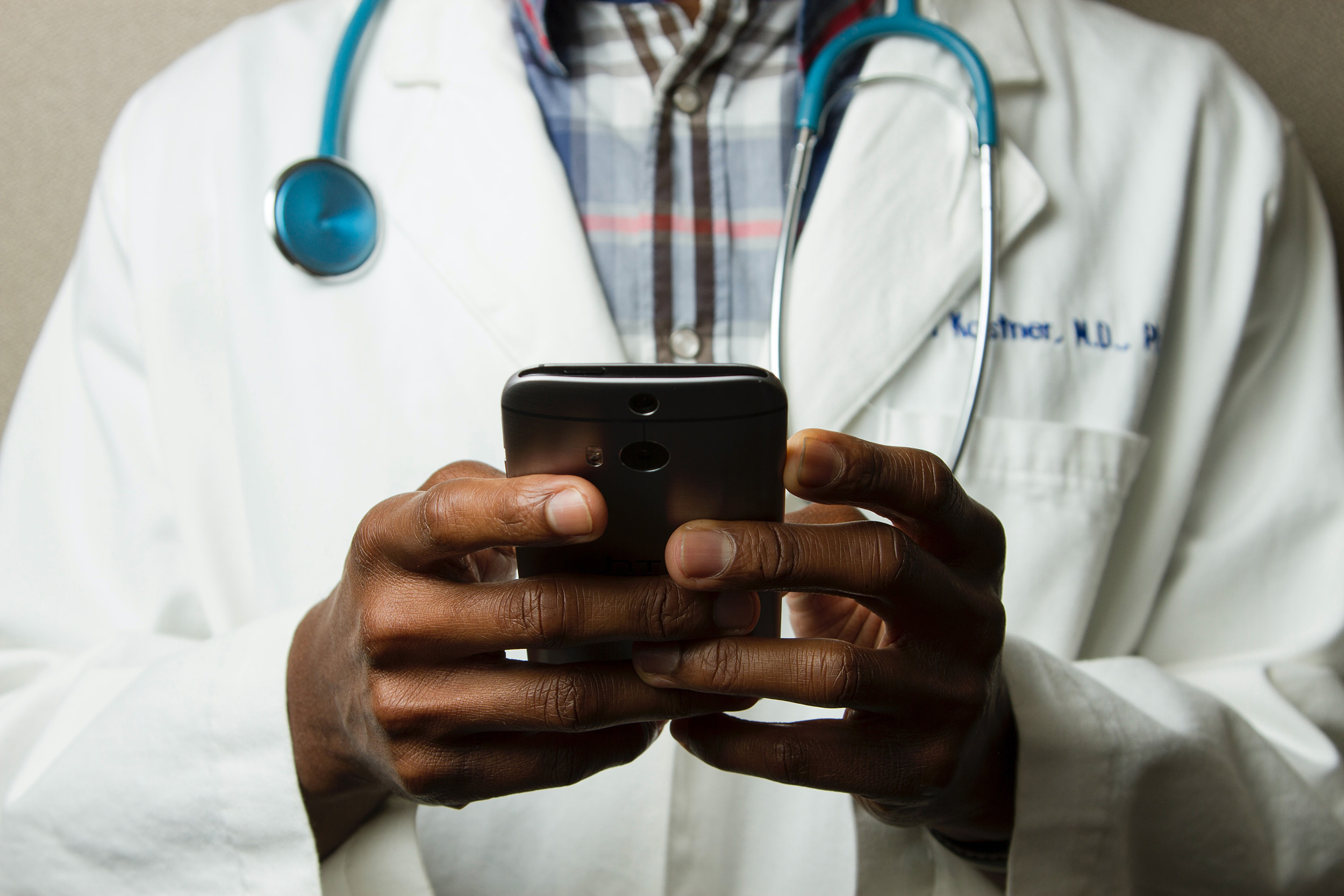 Doctor working with mobile device